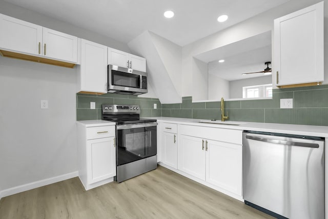 840 Pine Way Dr Unit D2, Columbus, OH 43085 - kitchen with stainless steel appliances, light countertops, light wood-type flooring, and recessed lighting