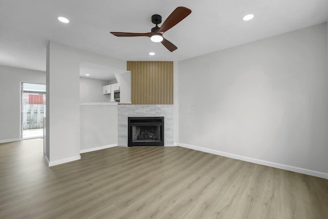 840 Pine Way Dr Unit D2, Columbus, OH 43085 - unfurnished living room with ceiling fan, wood finished floors, a fireplace, and recessed lighting