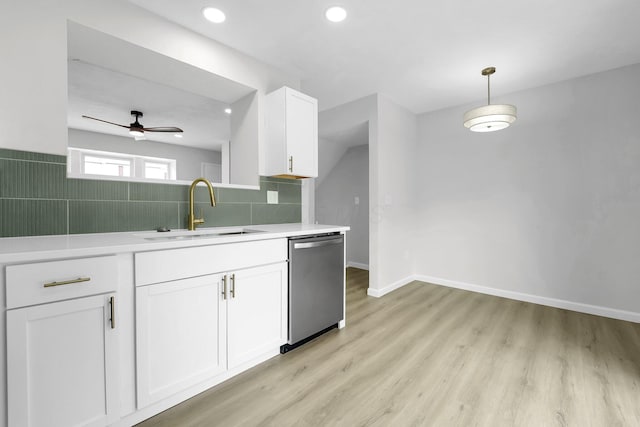 840 Pine Way Dr Unit D2, Columbus, OH 43085 - kitchen featuring dishwasher, light countertops, white cabinets, light wood finished floors, and backsplash