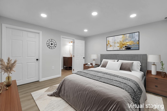 840 Pine Way Dr Unit D2, Columbus, OH 43085 - bedroom featuring wood finished floors, recessed lighting, and ensuite bath