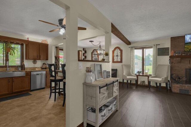 2542 Eckert Rd, Lexington, OH 44904 - living room featuring plenty of natural light, ceiling fan, and beam ceiling