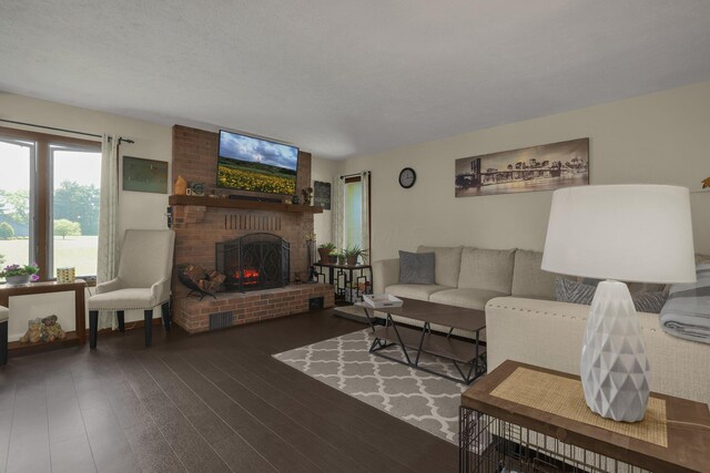 2542 Eckert Rd, Lexington, OH 44904 - living area with a brick fireplace and wood finished floors