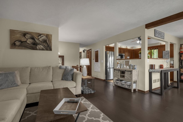 2542 Eckert Rd, Lexington, OH 44904 - living area with dark wood-type flooring, ceiling fan, and beam ceiling