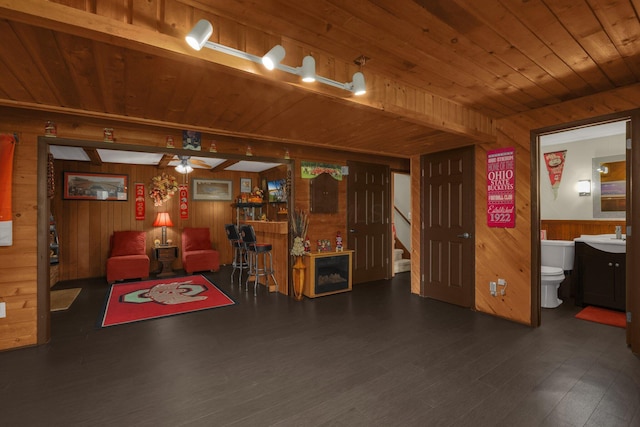 2542 Eckert Rd, Lexington, OH 44904 - living room featuring wood walls, wood ceiling, ceiling fan, and wood finished floors