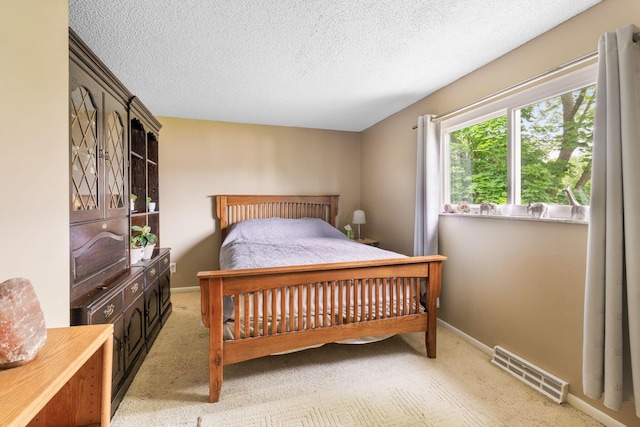 8621 Renford Ct, Powell, OH 43065 - carpeted bedroom with a textured ceiling and baseboards