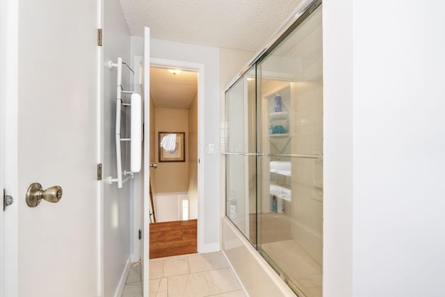 8621 Renford Ct, Powell, OH 43065 - full bath with a textured ceiling, enclosed tub / shower combo, and tile patterned flooring
