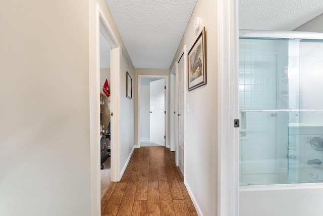 8621 Renford Ct, Powell, OH 43065 - hallway with a textured ceiling and wood finished floors
