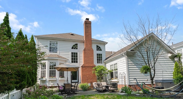 4949 Heath Gate Dr, New Albany, OH 43054 - rear view of property featuring a chimney and a patio area