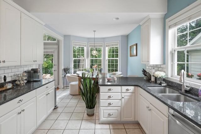 4949 Heath Gate Dr, New Albany, OH 43054 - kitchen with dishwasher, backsplash, light tile patterned flooring, and white cabinetry