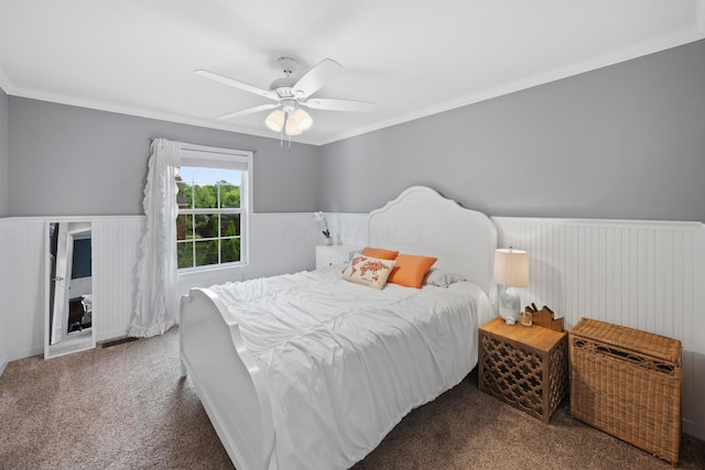 4949 Heath Gate Dr, New Albany, OH 43054 - carpeted bedroom featuring wainscoting, ornamental molding, and a ceiling fan