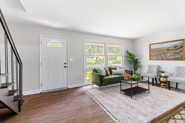 3920 Astor Ave, Columbus, OH 43227 - living room featuring stairs and wood finished floors