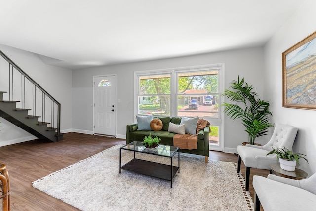 3920 Astor Ave, Columbus, OH 43227 - living room featuring stairs and wood finished floors