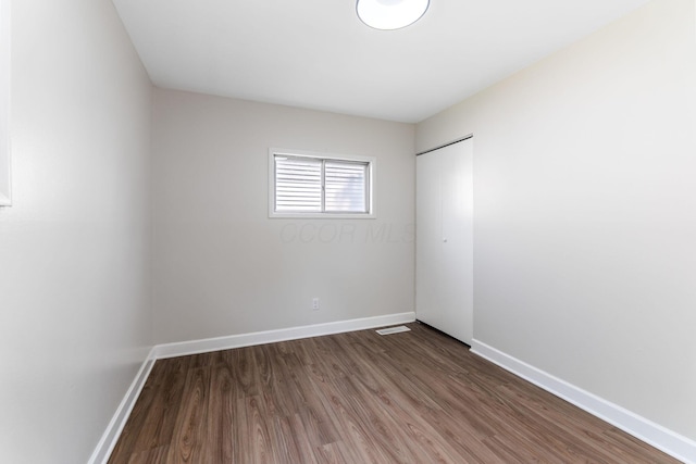 3920 Astor Ave, Columbus, OH 43227 - unfurnished bedroom featuring wood finished floors and a closet