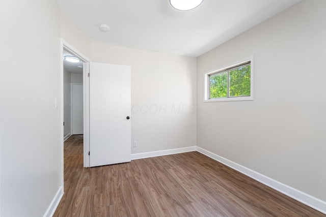 3920 Astor Ave, Columbus, OH 43227 - spare room featuring wood finished floors and a smoke detector