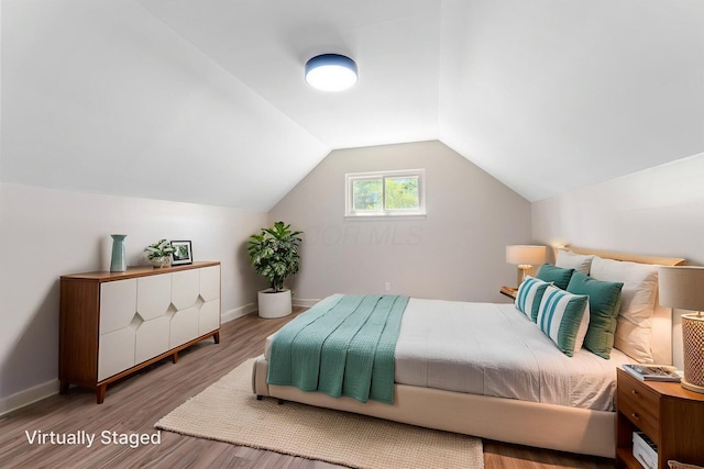 3920 Astor Ave, Columbus, OH 43227 - bedroom featuring wood finished floors and vaulted ceiling