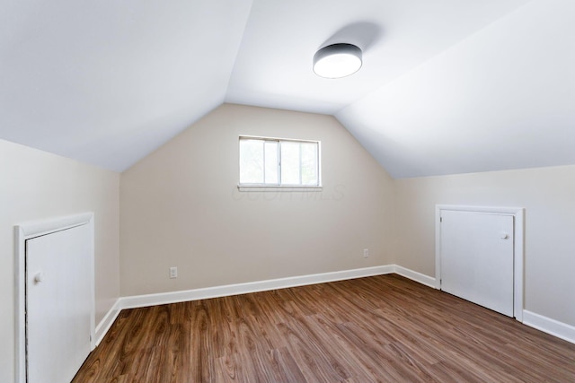 3920 Astor Ave, Columbus, OH 43227 - additional living space featuring wood finished floors and vaulted ceiling