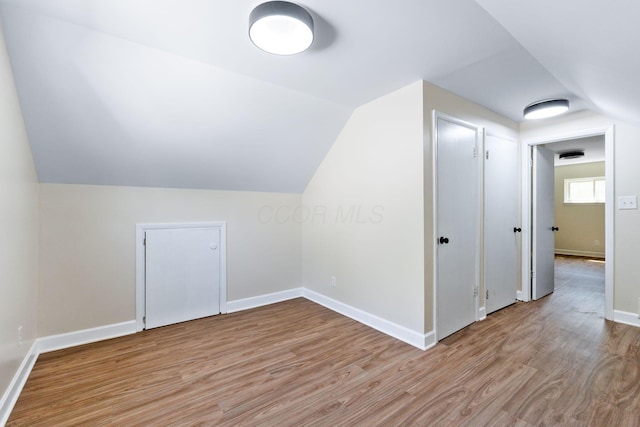 3920 Astor Ave, Columbus, OH 43227 - additional living space with light wood-style floors and vaulted ceiling