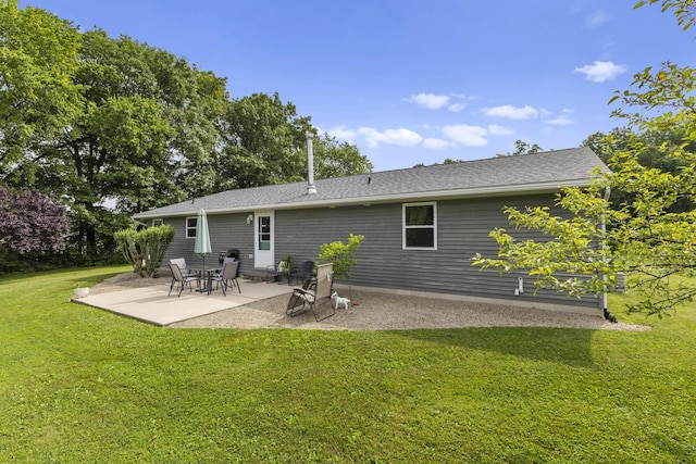 1290 Knorr Rd, Galion, OH 44833 - back of house featuring a lawn, a patio, and a shingled roof