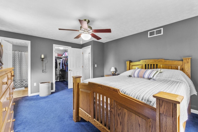 1290 Knorr Rd, Galion, OH 44833 - bedroom featuring carpet, a spacious closet, a closet, and a ceiling fan