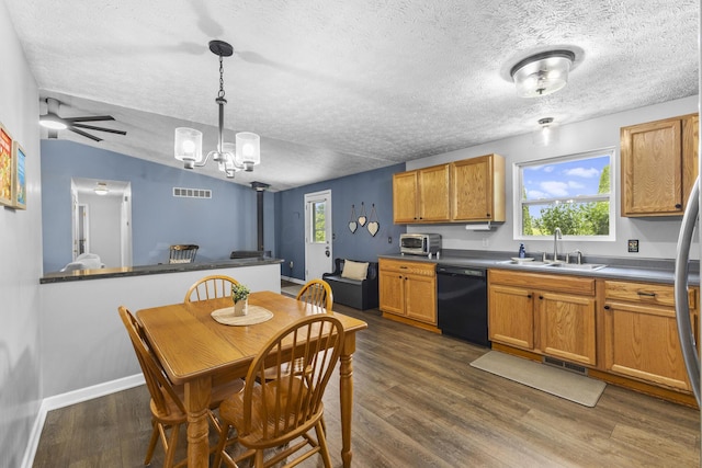 1290 Knorr Rd, Galion, OH 44833 - kitchen featuring black dishwasher, dark wood-style flooring, a textured ceiling, pendant lighting, and a chandelier