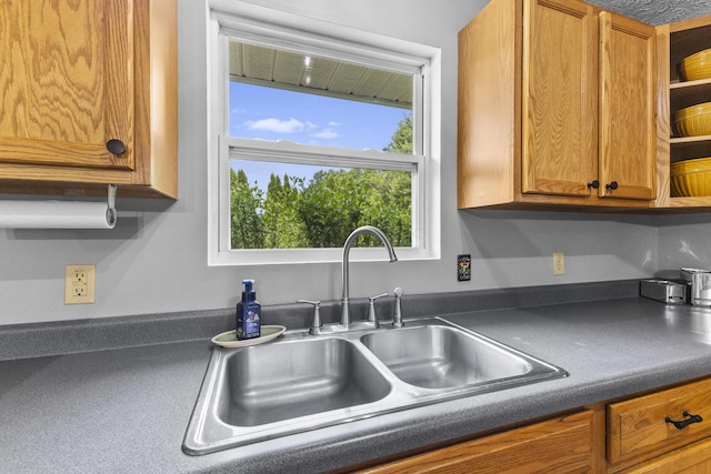 1290 Knorr Rd, Galion, OH 44833 - kitchen featuring open shelves, dark countertops, and brown cabinets
