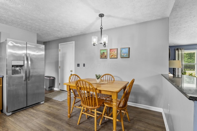 1290 Knorr Rd, Galion, OH 44833 - dining space with a textured ceiling, wood finished floors, and a chandelier