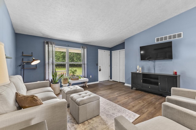 1290 Knorr Rd, Galion, OH 44833 - living area with wood finished floors, a textured ceiling, and lofted ceiling