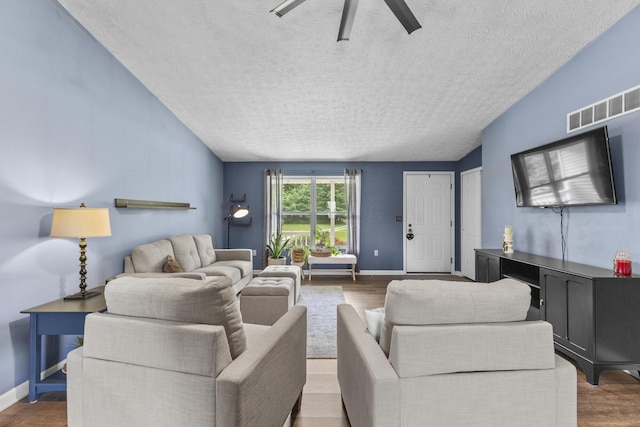 1290 Knorr Rd, Galion, OH 44833 - living room with a textured ceiling, wood finished floors, ceiling fan, and lofted ceiling