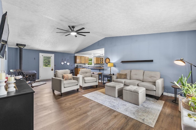 1290 Knorr Rd, Galion, OH 44833 - living area with a textured ceiling, ceiling fan, wood finished floors, and vaulted ceiling