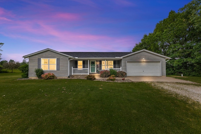 1290 Knorr Rd, Galion, OH 44833 - ranch-style home with a porch, gravel driveway, an attached garage, and a yard
