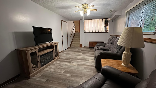 5109 Magnolia Blossom Blvd, Columbus, OH 43230 - living area with a textured ceiling, stairway, ceiling fan, and wood finished floors
