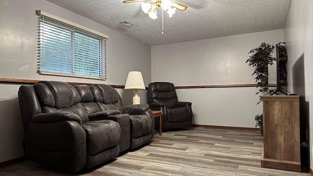 5109 Magnolia Blossom Blvd, Columbus, OH 43230 - living room with ceiling fan, wood finished floors, and a textured ceiling