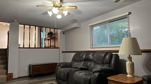 5109 Magnolia Blossom Blvd, Columbus, OH 43230 - living area with wood finished floors, a textured ceiling, and a ceiling fan