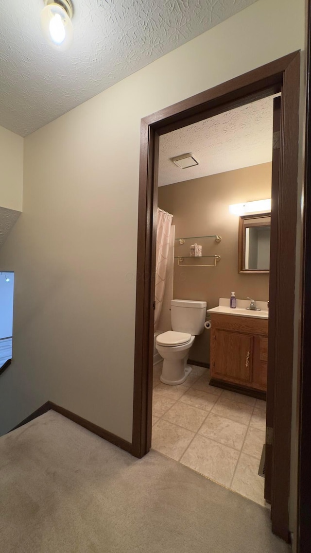 5109 Magnolia Blossom Blvd, Columbus, OH 43230 - bathroom featuring a textured ceiling, vanity, and a shower with curtain