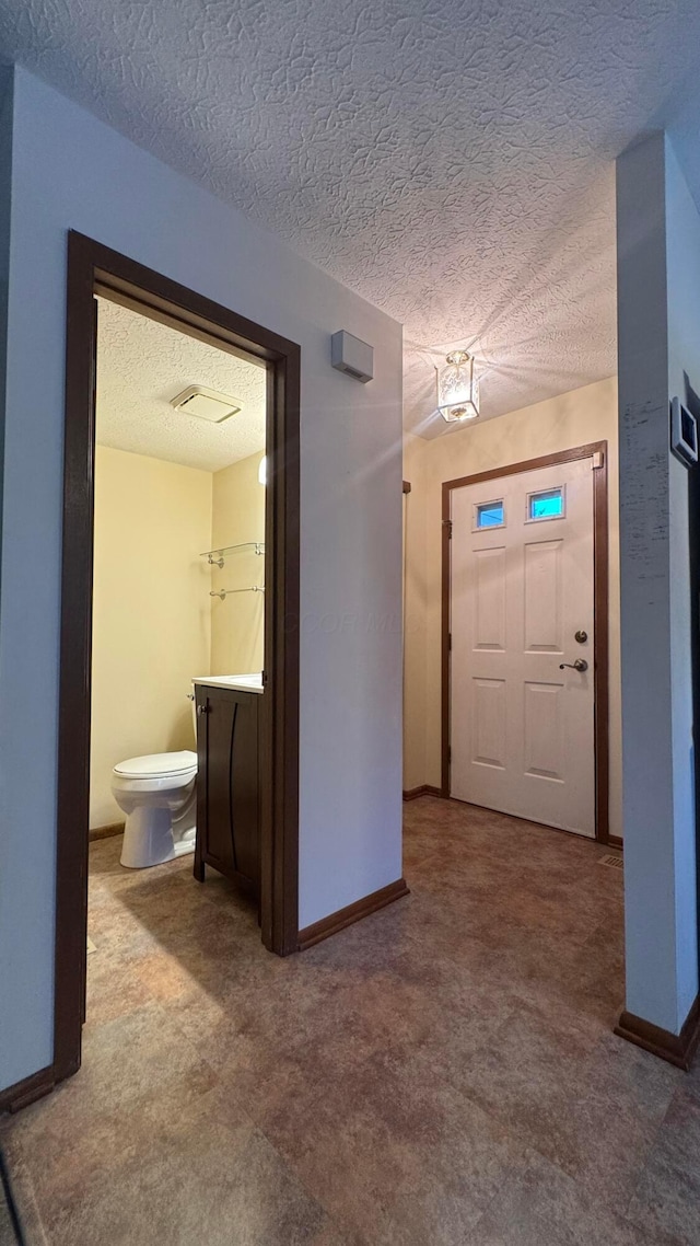 5109 Magnolia Blossom Blvd, Columbus, OH 43230 - carpeted foyer entrance with a textured ceiling and baseboards