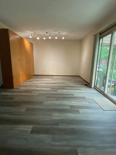 5109 Magnolia Blossom Blvd, Columbus, OH 43230 - empty room with light wood finished floors and rail lighting
