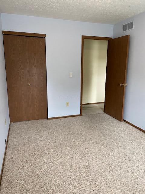 5109 Magnolia Blossom Blvd, Columbus, OH 43230 - spare room with carpet floors and a textured ceiling