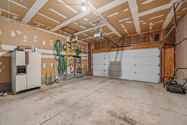 7591 Creekbend Dr, Pickerington, OH 43147 - garage featuring white fridge with ice dispenser and a garage door opener