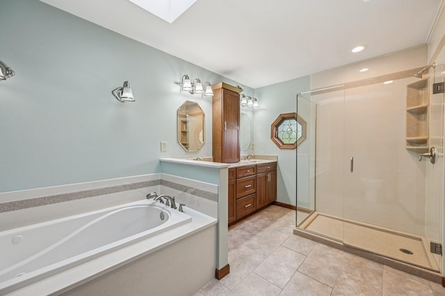 7591 Creekbend Dr, Pickerington, OH 43147 - bathroom with vanity, a bath, a stall shower, tile patterned flooring, and a skylight