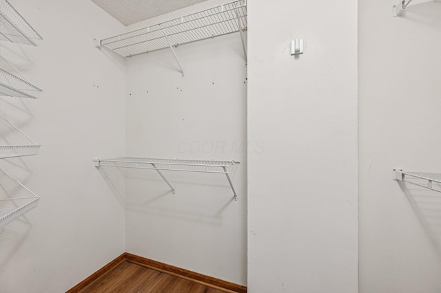 7591 Creekbend Dr, Pickerington, OH 43147 - walk in closet with wood finished floors