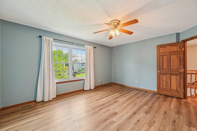 7591 Creekbend Dr, Pickerington, OH 43147 - empty room with a ceiling fan, light wood finished floors, and a textured ceiling
