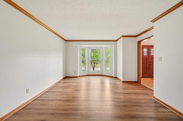 7591 Creekbend Dr, Pickerington, OH 43147 - spare room with ornamental molding, wood finished floors, and a textured ceiling