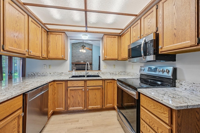 7591 Creekbend Dr, Pickerington, OH 43147 - kitchen featuring stainless steel appliances, light wood-style flooring, light stone counters, brown cabinets, and decorative light fixtures