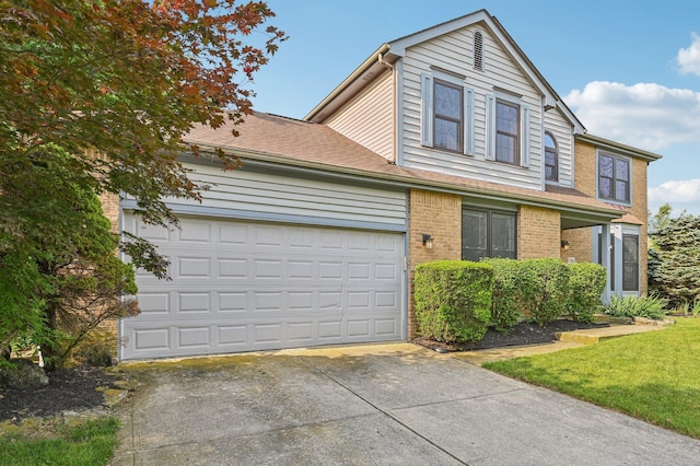 7591 Creekbend Dr, Pickerington, OH 43147 - traditional-style home featuring concrete driveway, an attached garage, and brick siding