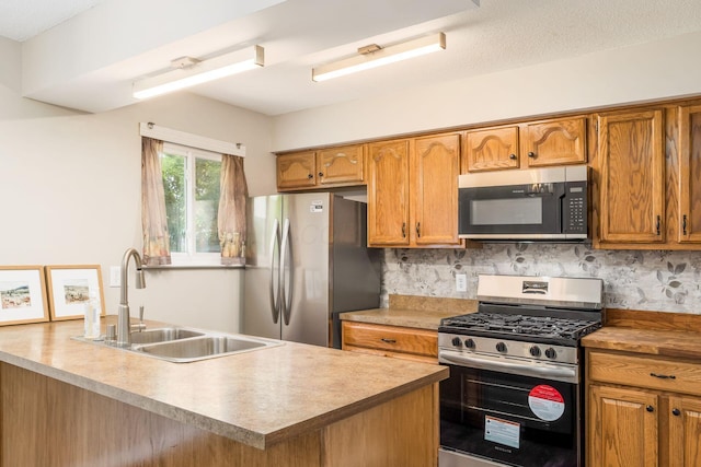5032 Labelle Dr, Columbus, OH 43232 - kitchen featuring stainless steel appliances, brown cabinets, decorative backsplash, and light countertops