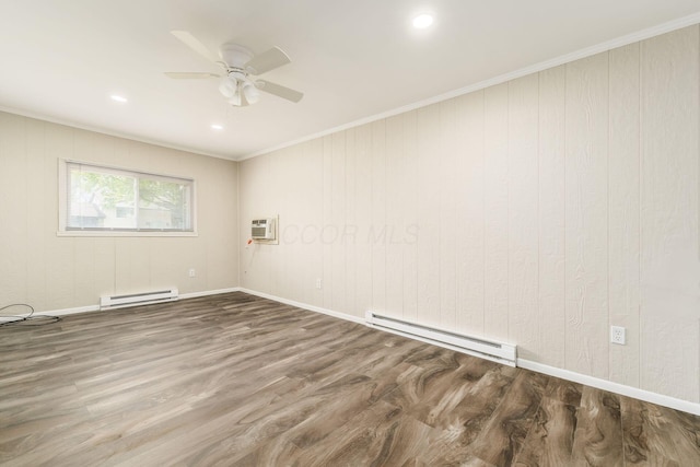 5032 Labelle Dr, Columbus, OH 43232 - spare room with a baseboard radiator, ceiling fan, wood finished floors, a wall unit AC, and crown molding