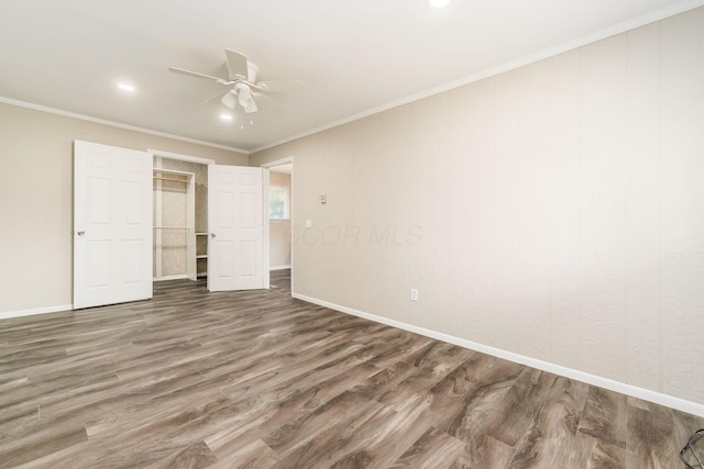 5032 Labelle Dr, Columbus, OH 43232 - unfurnished bedroom with wood finished floors, crown molding, ceiling fan, recessed lighting, and a closet
