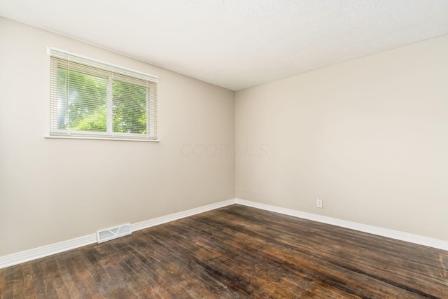 5032 Labelle Dr, Columbus, OH 43232 - unfurnished room with baseboards and dark wood-style flooring