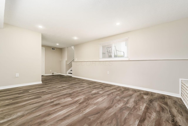 5032 Labelle Dr, Columbus, OH 43232 - empty room featuring wood finished floors, stairway, and recessed lighting