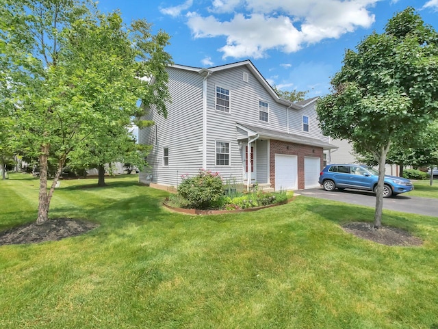 4809 King Albert Dr Unit 1A, Hilliard, OH 43026 - view of home's exterior with asphalt driveway, an attached garage, a yard, and brick siding